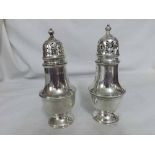 A pair of George VI Silver Sugar Castors of baluster form, fitted with pull-off lid, raised on