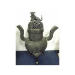 A Chinese Bronze Koro, the pierced cover crested with a Kaolin and with two pierced handles (both