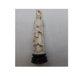 A Chinese Ivory Carved Figure of a wise man clutching a staff, 6 1/2" high 65-75