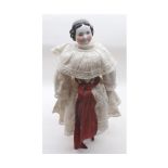 A Porcelain Head and Shoulder Plate Doll with painted facial features, moulded black hair, on