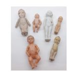 A Tray containing six assorted Dolls, to include two Celluloid Thumbs Up; Japanese All China Doll;