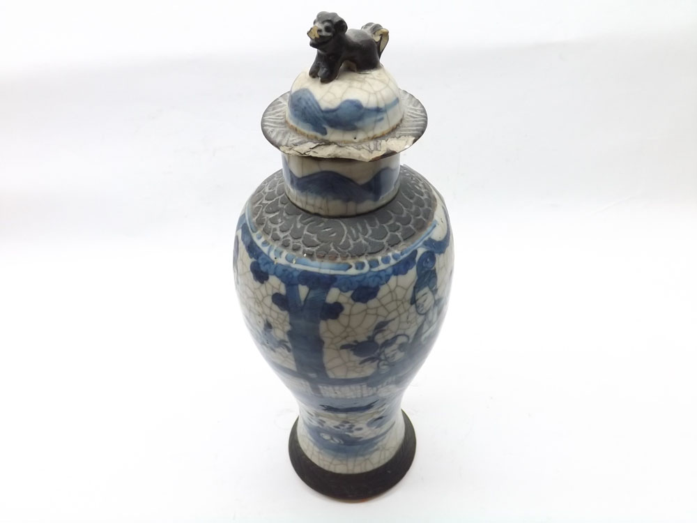 A Chinese Crackle Glaze Vase of tulip baluster form, decorated in blue with figures etc (cover