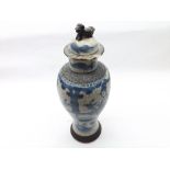 A Chinese Crackle Glaze Vase of tulip baluster form, decorated in blue with figures etc (cover