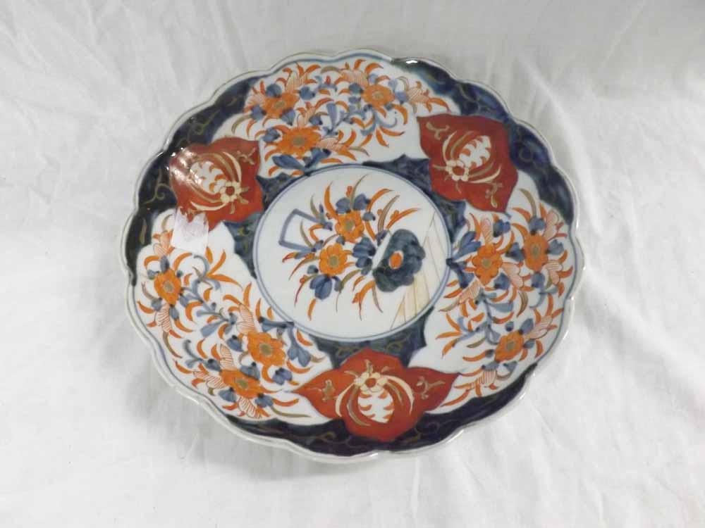A Japanese Imari Circular Bowl with a hipped rim, typically decorated in traditional colours, 11"