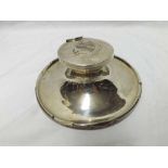 George V Silver encased Capstan Inkwell, the hinged lid engraved with an heraldic crest, lacking