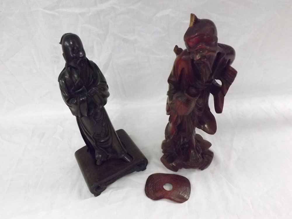 Two Oriental Lacquered Hardwood Figures, a man with a water pot (A/F); together with a further model