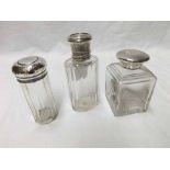 A group of three early 20th Century Silver/White metal lidded Dressing Table Jars including square