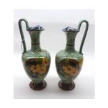A pair of Royal Doulton Faience Ewers of tapering circular conical form, decorated with a stylised