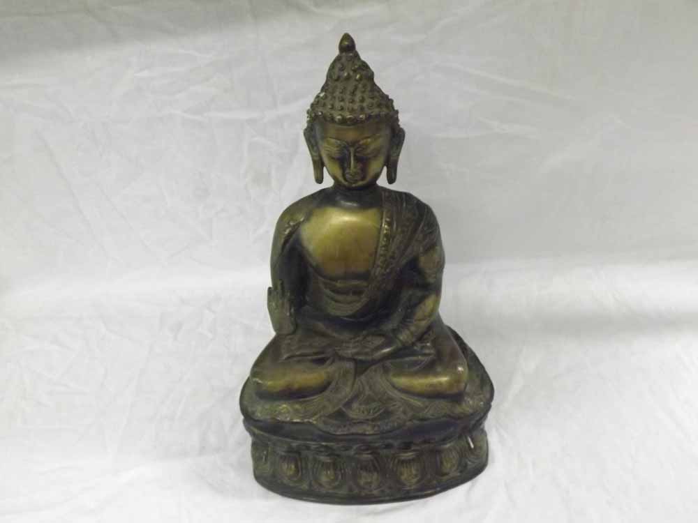 An Oriental Bronze Study of a seated deity in the lotus position, wearing traditional head-dress and