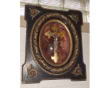 A Framed Plaque depicting a central Crucifix in gesso mounted and gilded frame, 19" high   30-40