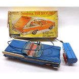 A mid-20th Century Battery Powered Remote Control Automatic/Push-Button Retractable Top Ford