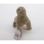 A mid-20th Century Steiff Robby Seal in cream cut mohair with chest tag, height 5"