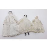 A collection of three small Dolls comprising: Porcelain Head and Shoulder Plate Doll with black