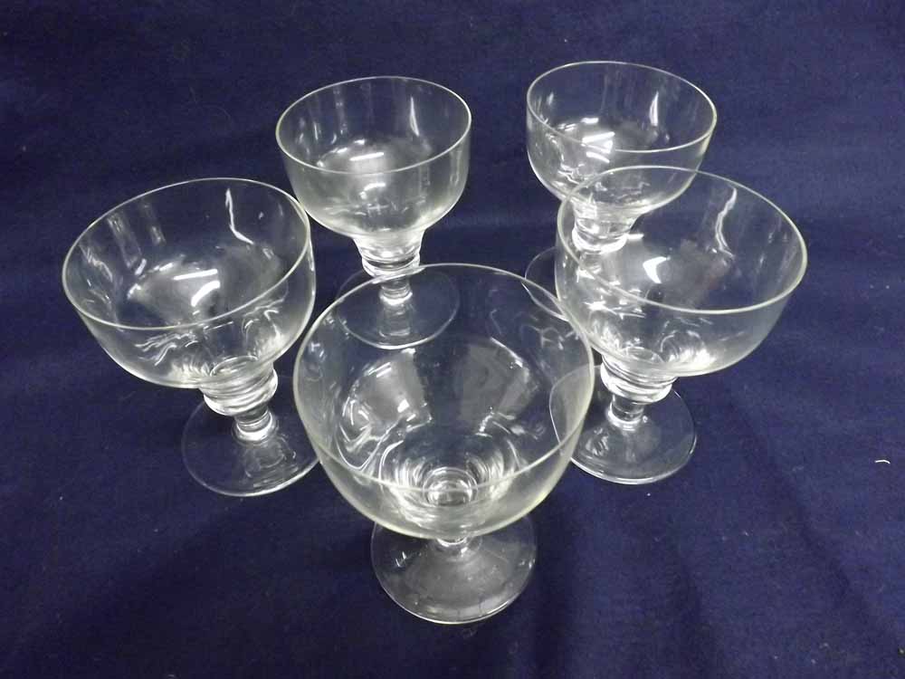 A set of five Regency style large Wine Glasses with funnel bowls, single knopped stems and spreading