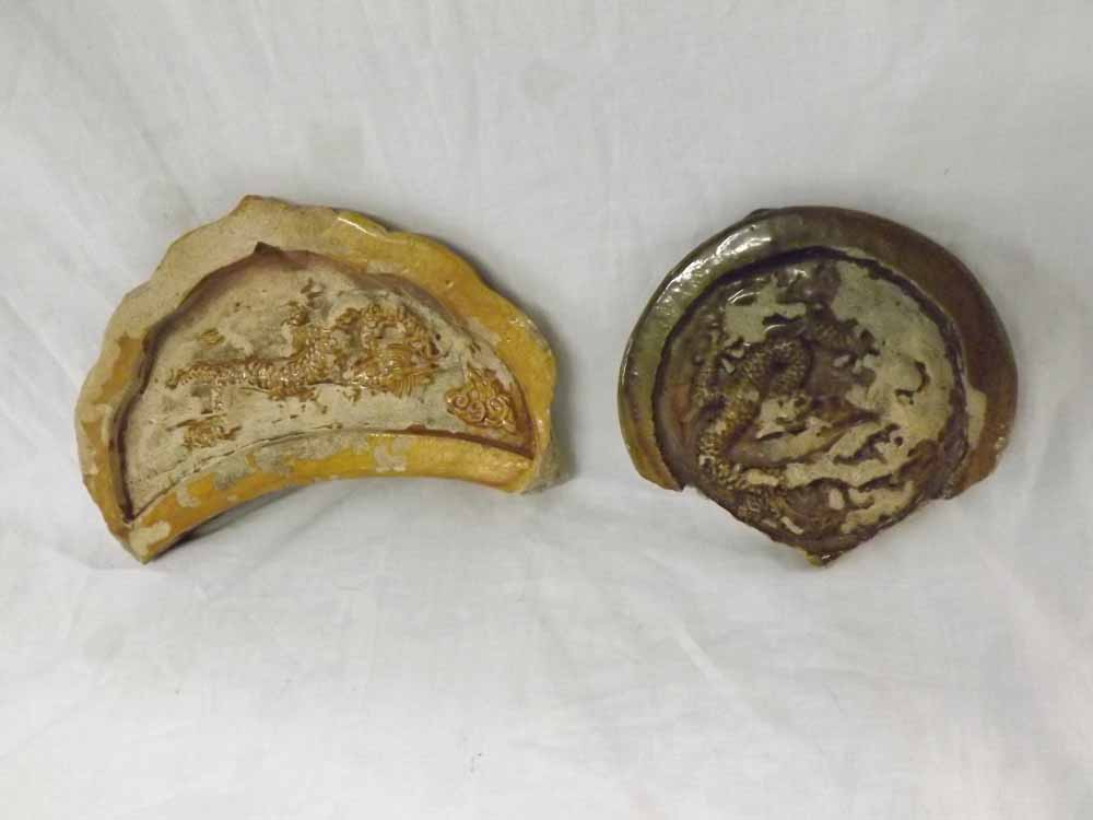 Two Oriental Pottery Fragments each embossed with dragons (chips and losses etc), 9" and 6" wide (2)