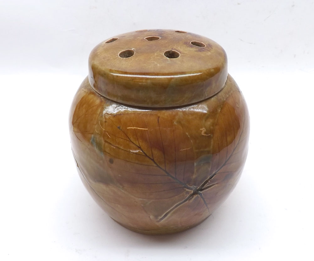 A Royal Doulton Stoneware Lidded Posy Holder/Jar with pierced cover, decorated with an autumn leaf