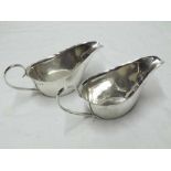 Pair of George IV small Sauce Boats of typical form with card cut rims, solid looped handles, 6"