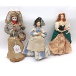 A collection of three Dolls, comprising of: a Bisque Brettan Doll dressed as a fish seller; a