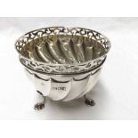 An Edwardian Silver Sugar Bowl, circular shape with scroll pierced rim, wrythen fluted body,