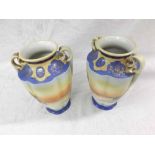 A pair of Noritake Baluster Vases of two handled fluted tapering Baluster form painted in colours