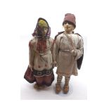 A pair of mid-20th Century Folk Art Dolls depicting Romanian peasants, in original costume   30-40