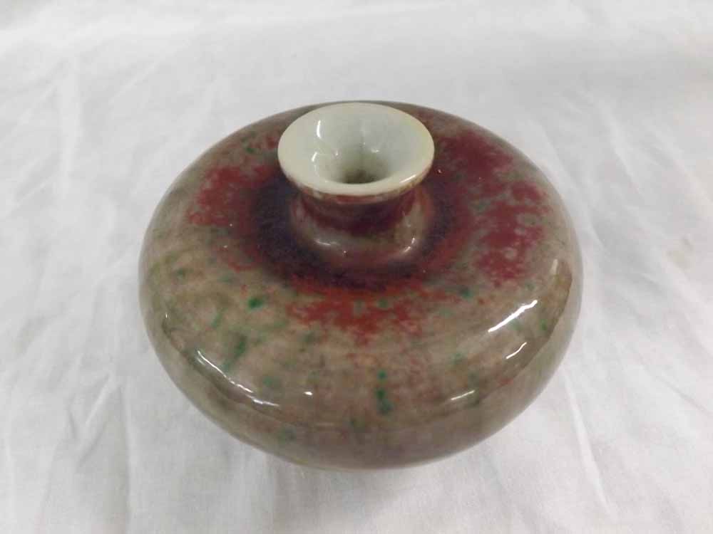 A Chinese Small Spill Holder of balustered circular form, decorated with a streaked design in the