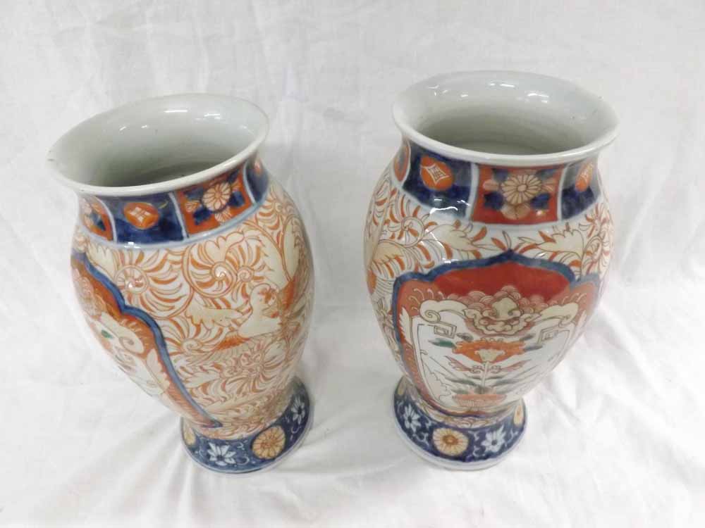 A pair of Japanese Imari Baluster Vases, typically decorated in traditional colours, 10” high