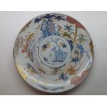 A 20th Century Chinese Charger, decorated in the Arita manner with scene of figures, animals and