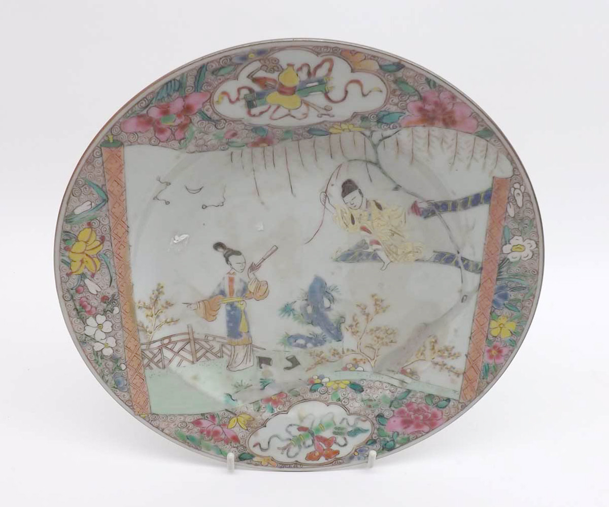 An 18th Century Chinese Circular Plate, painted in colours with scene of young lady in a garden