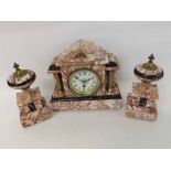 A late 19th Century variegated pink Marble garniture timepiece, the architectural case with free