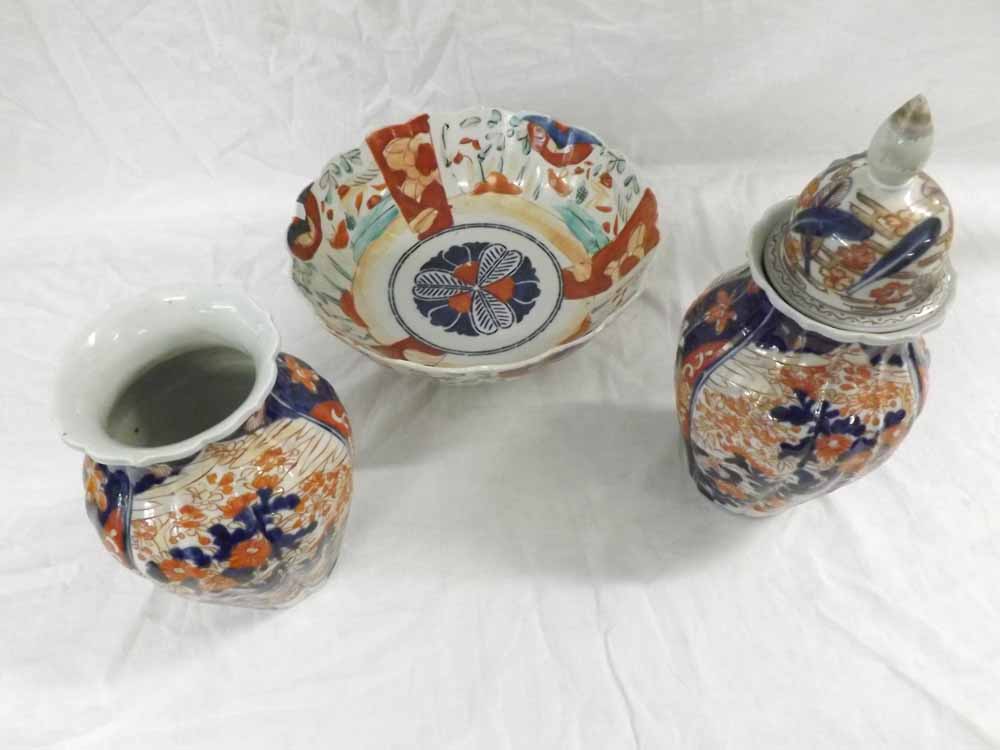 A pair of Japanese Imari Baluster Vases of ribbed circular form; a further Imari Bowl and a