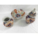 A pair of Japanese Imari Baluster Vases of ribbed circular form; a further Imari Bowl and a