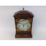 A late 20th Century Mahogany cased triple spring driven Mantel Clock, the case with overhanging