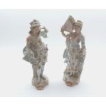 Pair of late 19th Century Continental figures in classical dress raised on plinth bases, 10” high