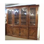 An early 19th Century Mahogany two-piece break front Library Bookcase, the top section with