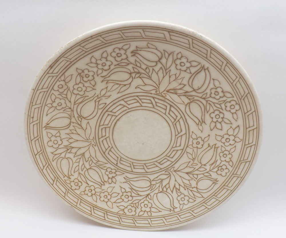 A Charlotte Rhead Bursley Ware Charger, decorated with tube lined floral design, marked to reverse
