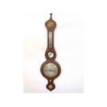 A mid-19th Century Mahogany cased Wheel Barometer, the onion topped case set with silvered