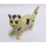 Gallé style model of a cat, yellow body and decorated with blue geometric designs and with