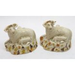 Pair of Green & Co (Leeds) models of sheep and lambs, each decorated in ochre and brown and pale