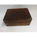 Victorian rectangular Rosewood Vanity Case, the hinged lid opening to an interior fitted with jars
