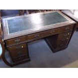 A late Victorian Mahogany twin pedestal Desk, the top with green leather inset, the body with one