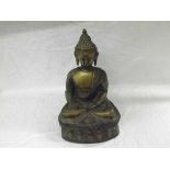 An Oriental Bronze Study of a seated deity in the lotus position, wearing traditional head-dress and