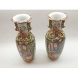 Pair of 19th Century Chinese Canton Vases, typically decorated with panels, various figures, foliage