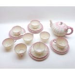 A Belleek Shell moulded Tea Service, comprising a Tea Pot, six Cups, and two Saucers, Sugar Bowl and