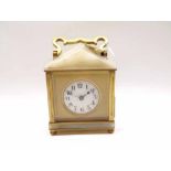 A first quarter of 20th Century gilt Brass and white Onyx mounted carriage type timepiece, the