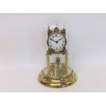 A first quarter of 20th Century German lacquered Brass year going timepiece of typical form with