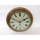 An early 20th Century Walnut cased dial timepiece, the plain quartered surround to a spun Brass