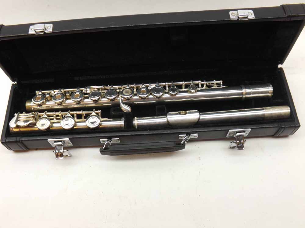 A late 20th Century Silver Plated Flute, impressed “Designed by Japan” in a plush-lined case, 16”