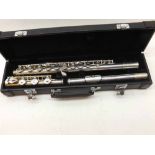 A late 20th Century Silver Plated Flute, impressed “Designed by Japan” in a plush-lined case, 16”