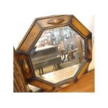 A 1930s Oak Octagonal Wall Mirror with central bevelled mirror plate, 19” wide
